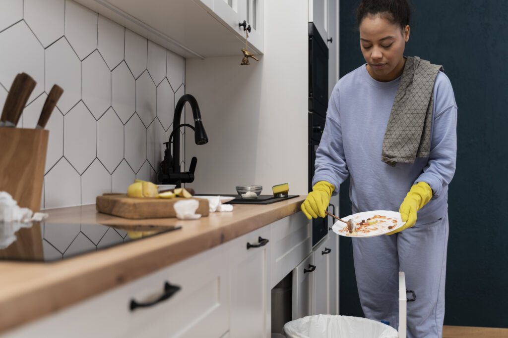 A woman trying to clean up dirty plate